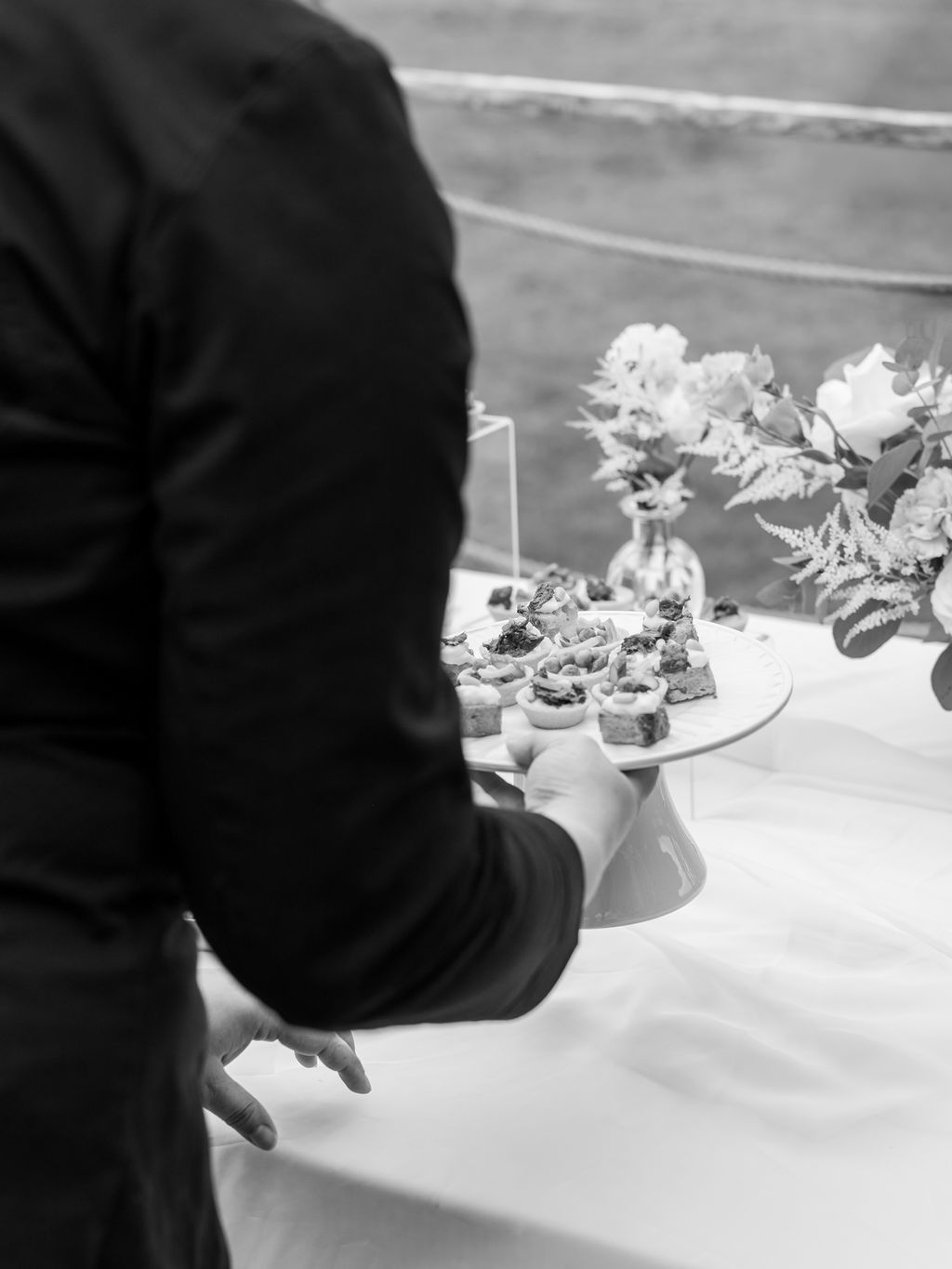 Marie Bernard and the couple around the wedding buffet